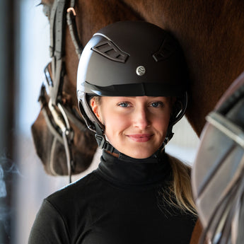 Back on Track Lynx smooth top riding helmet with sleek design, safety features, and infrared comfort lining